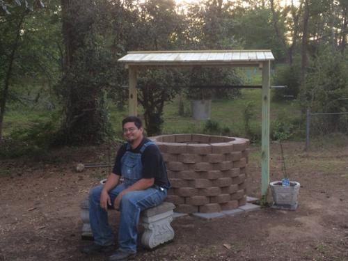 After completing the wishing well construction, complete with bench, roof, and well bucket.