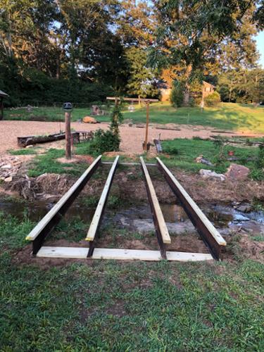 Bridge beams laid out with 2x4 caps installed.